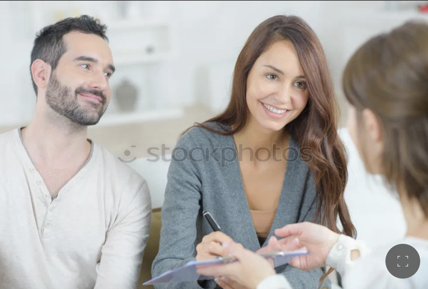 Maria speaking at a podium in front of community members